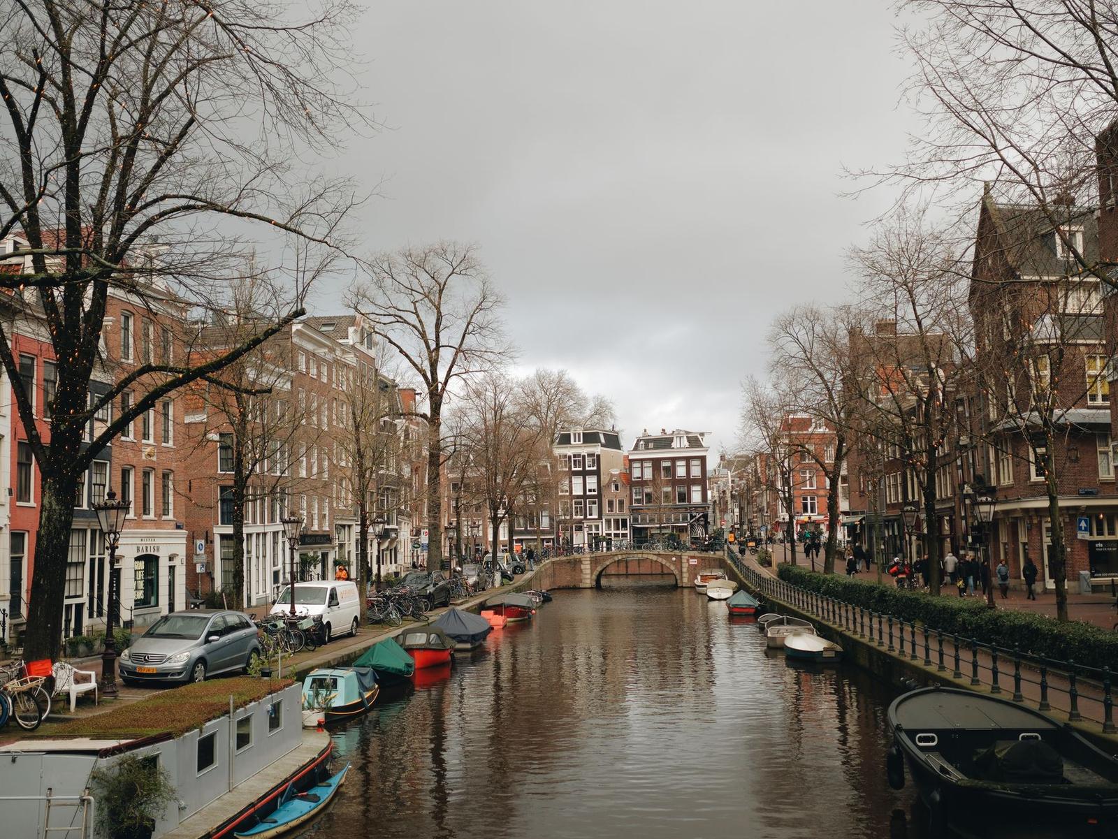 Brick Townhouses Along a Canal in Amsterdam